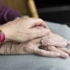 This shows an older lady's hands