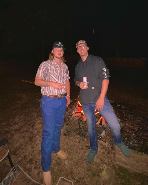 Colin appeared with a cigar in his hand while posing with Chase Matthew