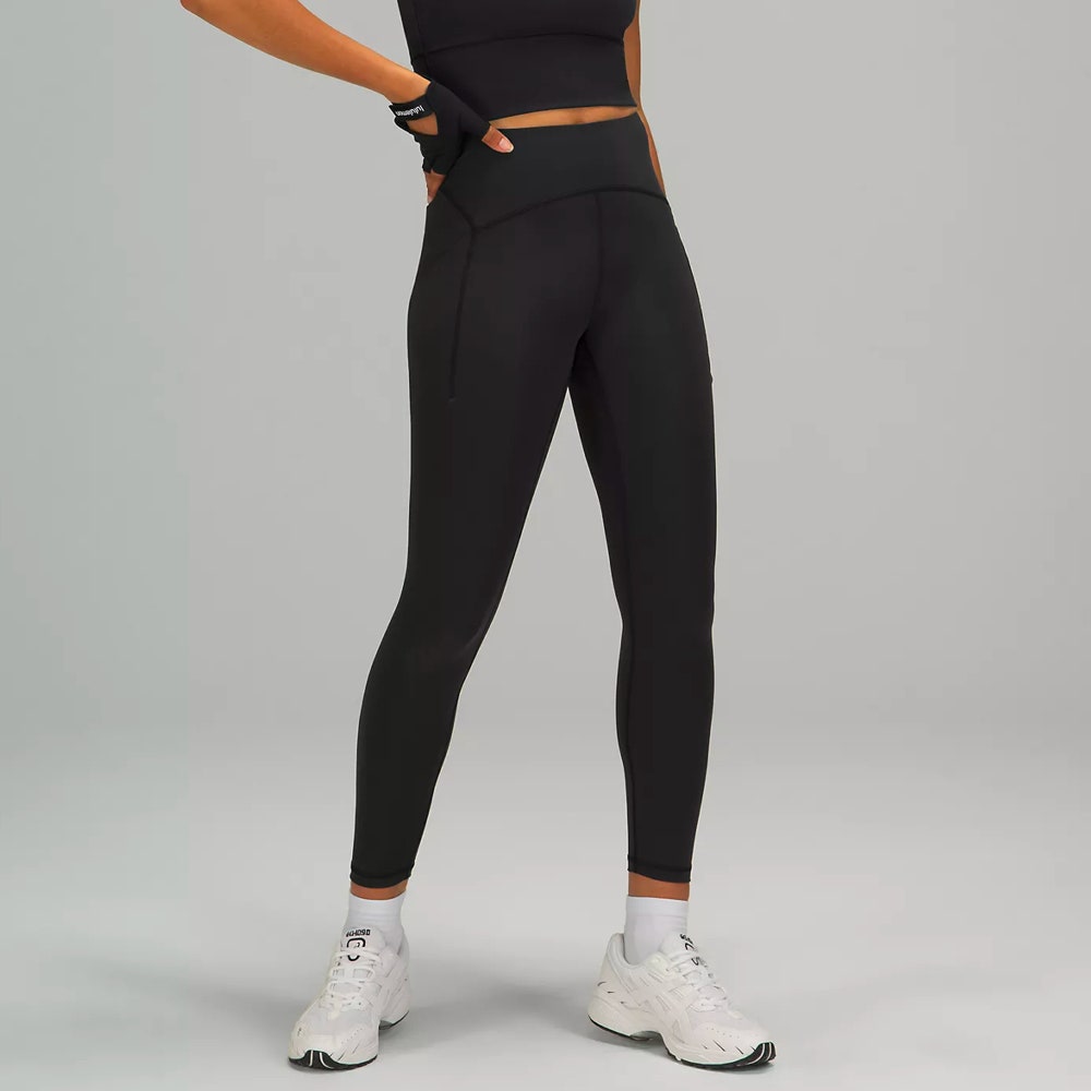 Model wearing Lululemon Power Thru High-Rise Tight in black