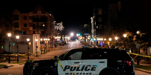 A police car is seen at Main Street in downtown Waukesha after a car plowed through a holiday parade in Waukesha, Wisconsin, on Nov. 22, 2021. REUTERS/Cheney Orr
